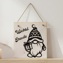 Wichtelfiguren Weihnachten mit der Aufschrift "Wichtel Freude" und einer schwarzen Zwergenillustration, die ein Geschenk hält