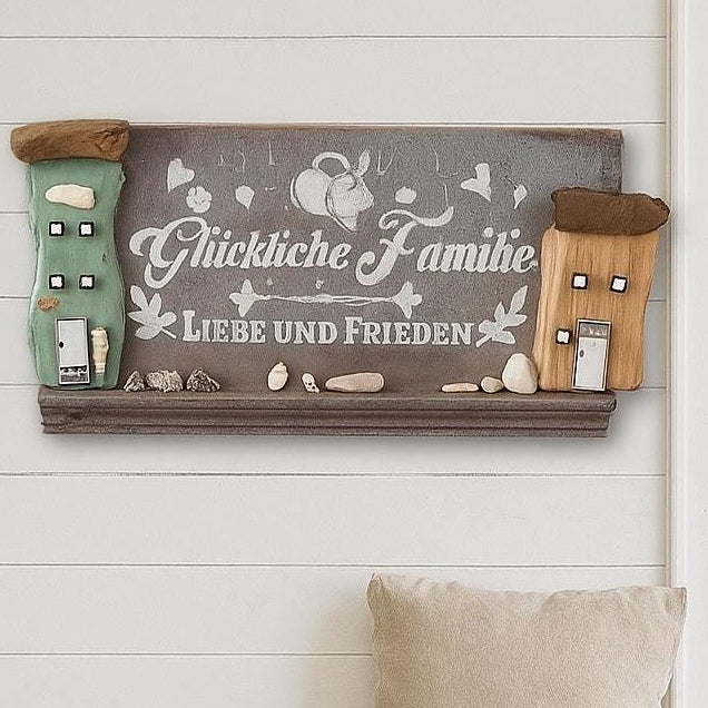 Vintage Wanddeko, Glückliche Familie - Liebe und Frieden mit bunten Treibholzhäuschen, fotografiert über eine Holzbank